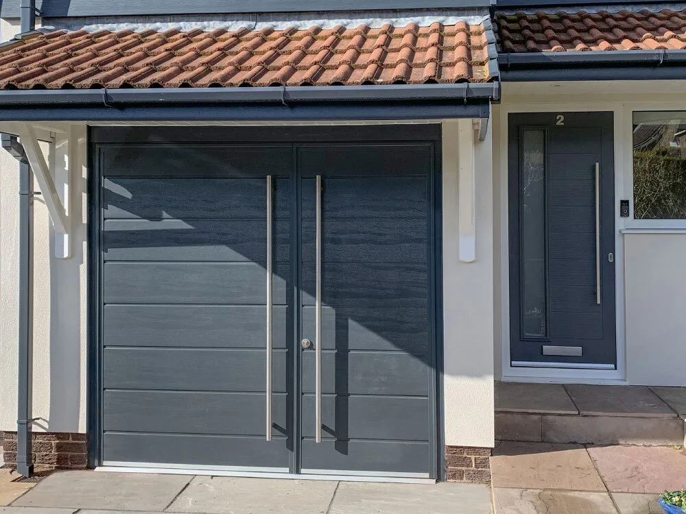 A dark roller door fitted beside a front entrance